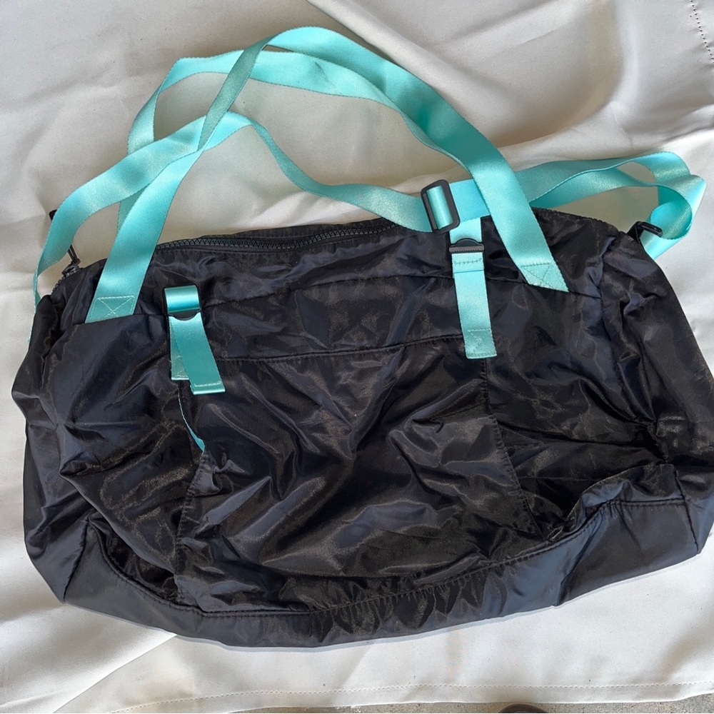 Women black tote bag with turquoise straps